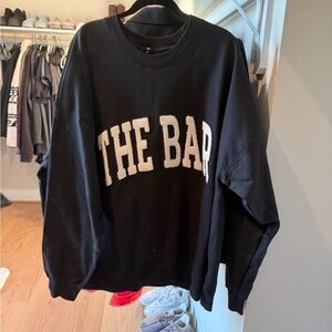 The Bar Black Crewneck Sweater with White Chenille Lettering